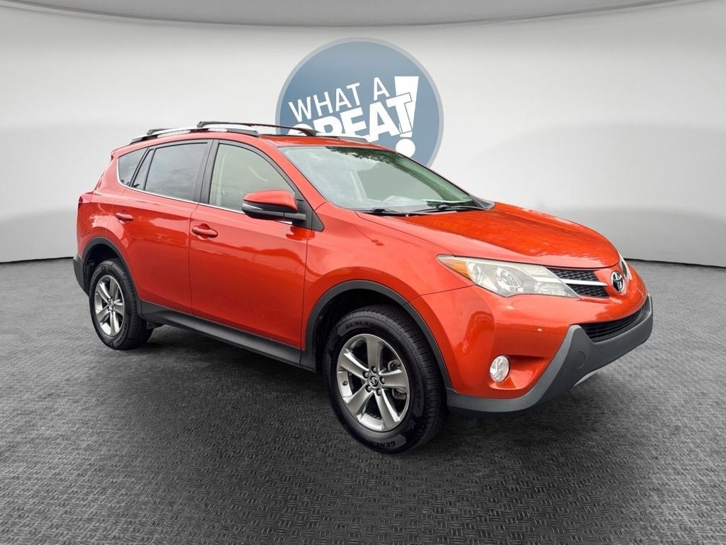 2015 Toyota RAV4 XLE in Hot Lava — front three-quarter view